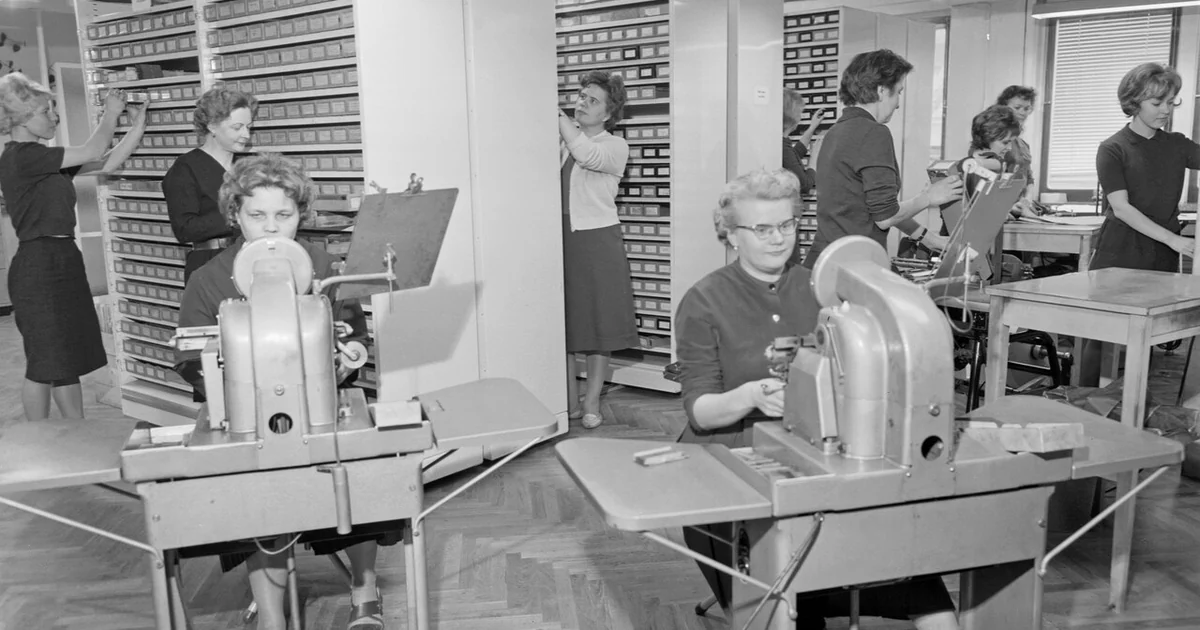Simonpaino printing house in Helsinki, Finland on 23rd November 1961. Printing house workers are printing addresses to the newspapers.